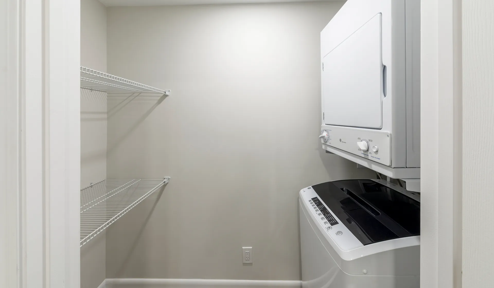 Modern laundry room showcasing a sleek, compact washer and dryer set with ample shelving space, perfect for maximizing efficiency.
