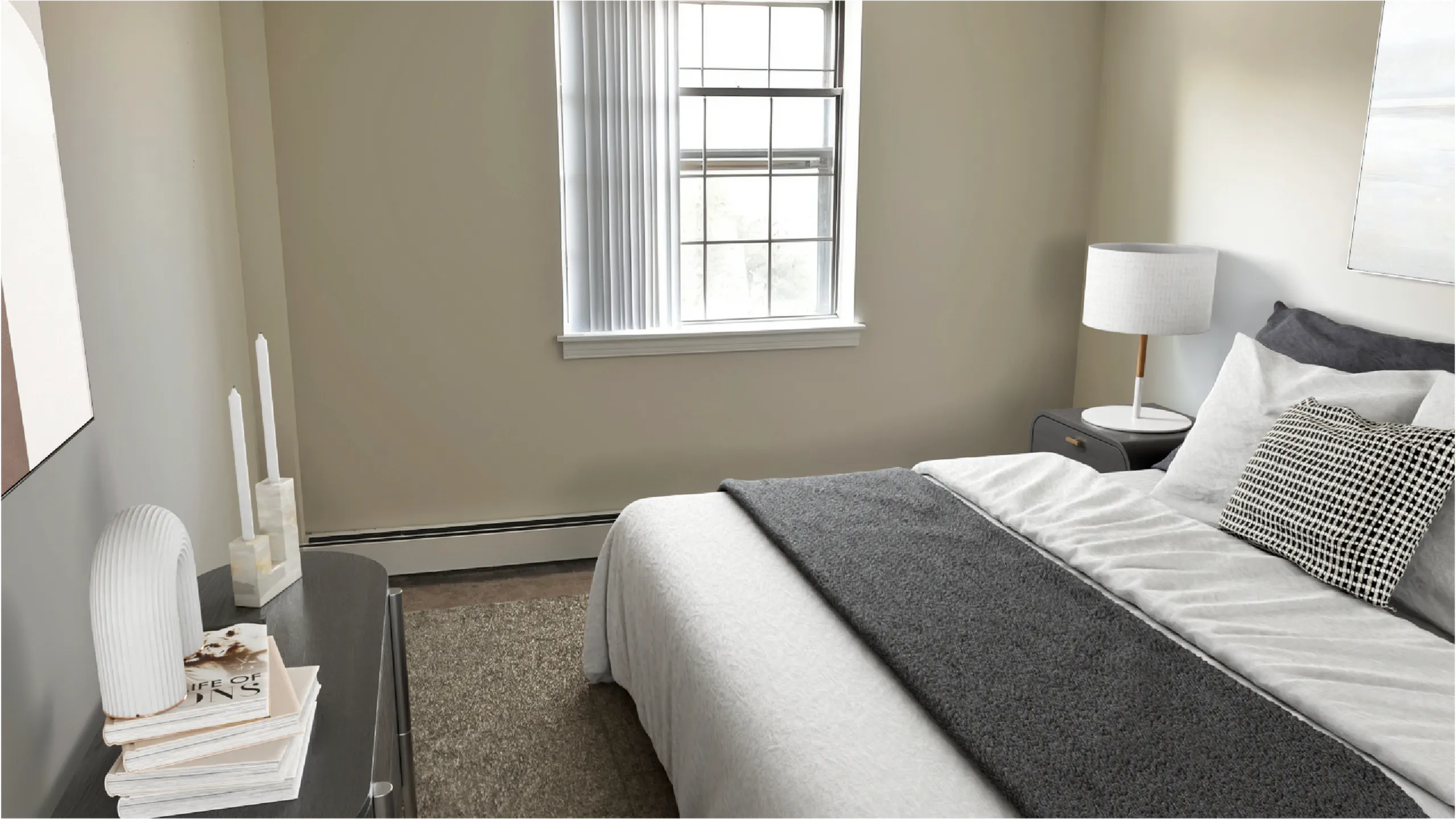 Bright and inviting bedroom featuring a cozy bed, elegant decor, and large window allowing natural light to illuminate the space.