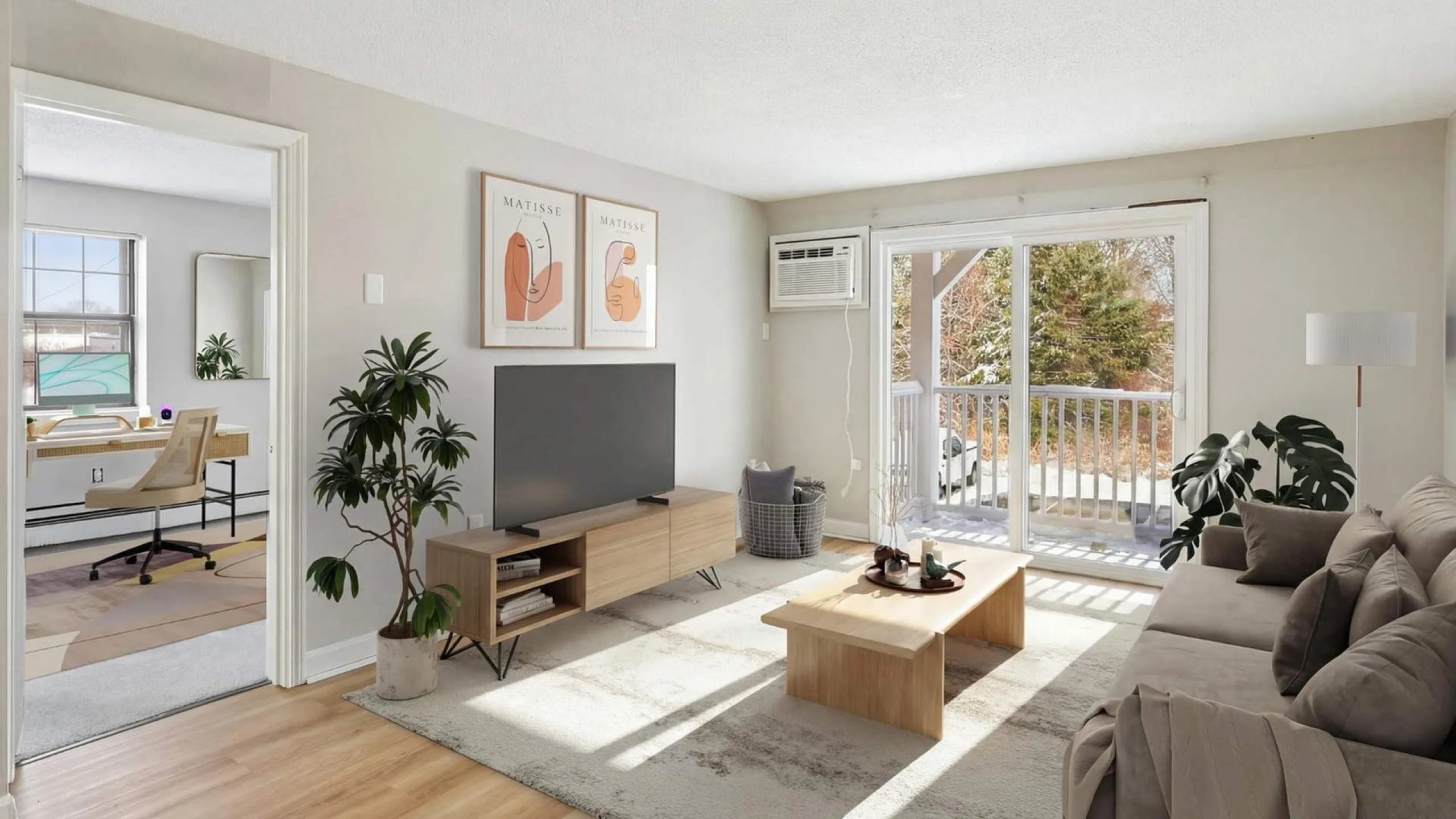 Bright living room with modern decor, featuring cozy sofa, stylish TV unit, and large sliding doors opening to a serene balcony view.