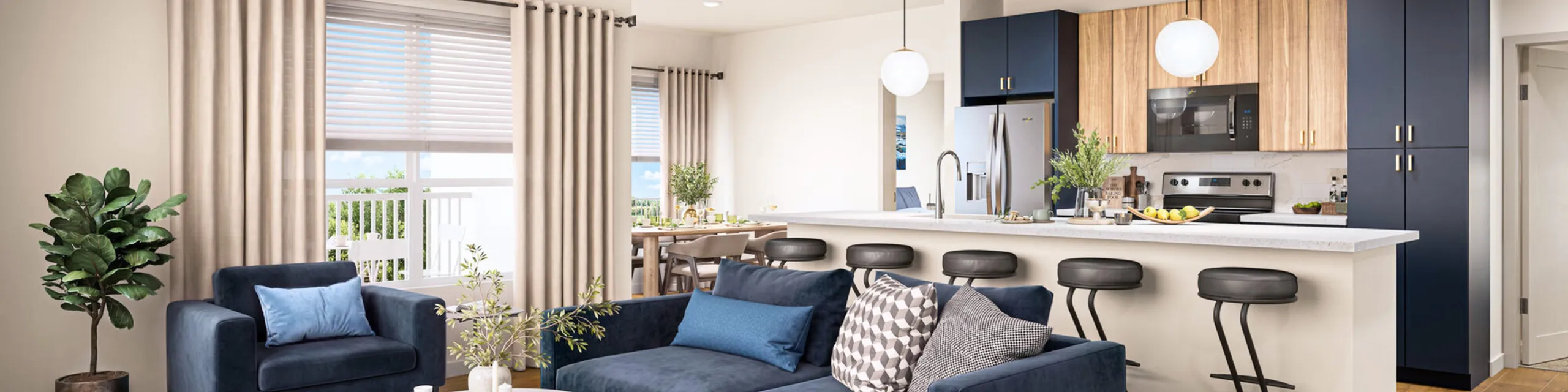 Modern open-concept living area with stylish navy accents, plush seating, and a sleek kitchen island with bar stools.