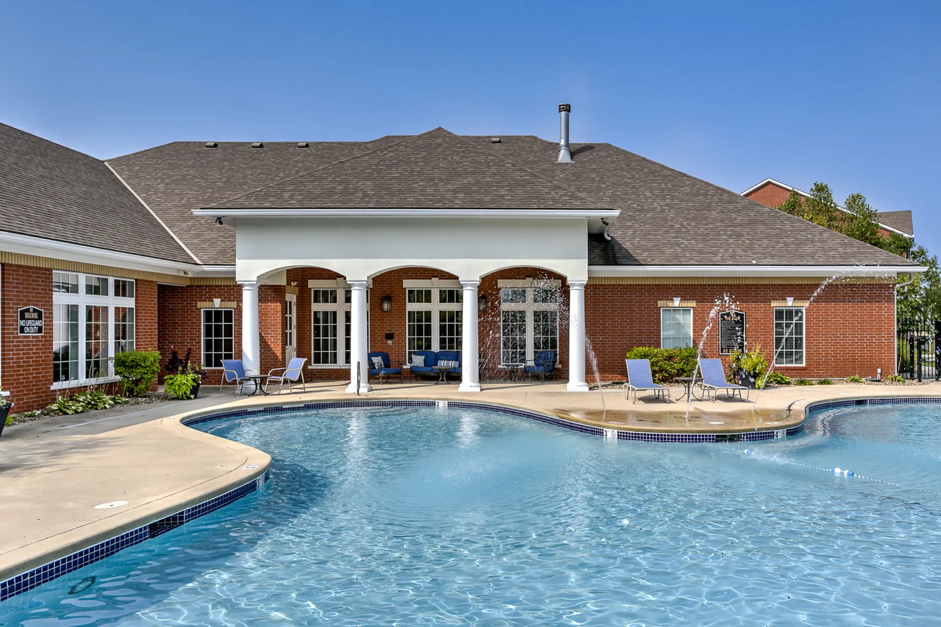 Luxurious outdoor pool area with elegant arches and inviting lounge chairs, perfect for relaxation and enjoyment.