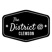 Elegant logo of The District at Clemson, featuring a sleek black and white design with stylish typography and star accents.