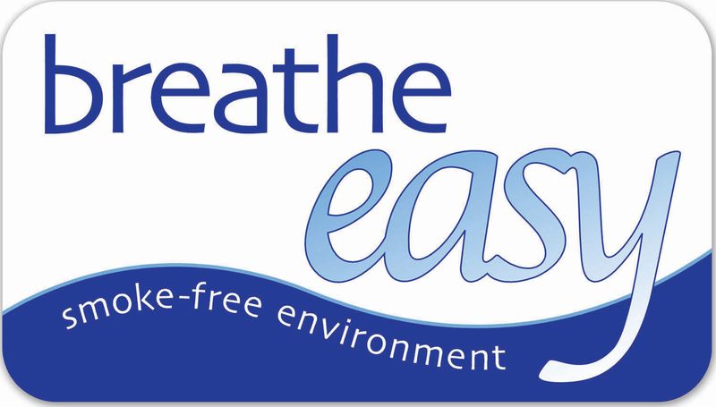 Inviting sign promoting a smoke-free environment with \'Breathe Easy\' in bold, calming blue tones.