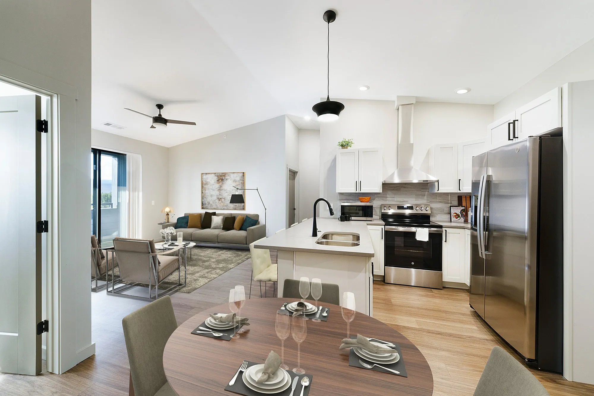 Modern open-concept living space featuring a chic kitchen, cozy living room, and stylish dining area, perfect for entertaining.