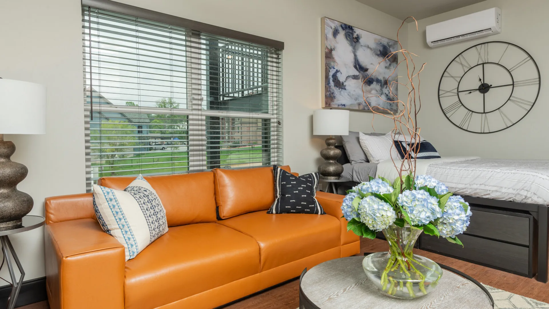 Galloway Creek Studio Apartment Bedroom with bed and couch near window