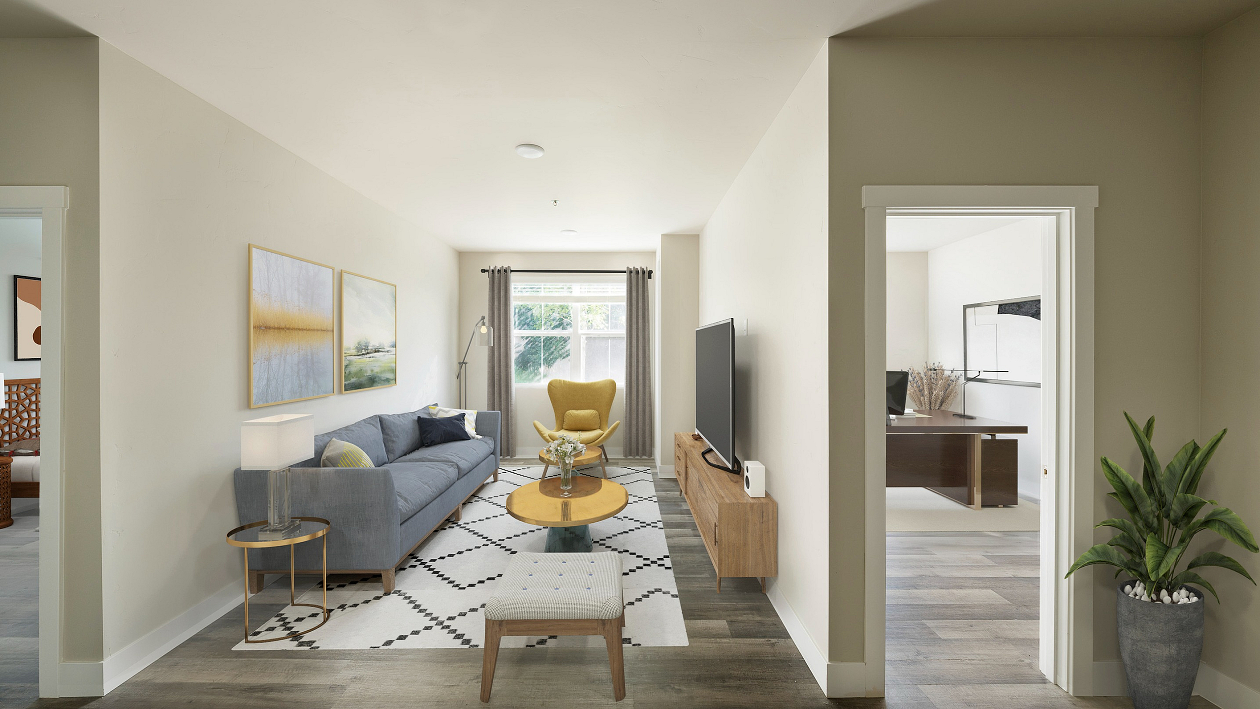 Chic living room with modern decor, featuring a cozy gray sofa, stylish yellow chair, and large flat-screen TV.