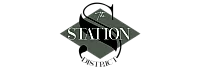Elegant logo design reading 'The Station' with a modern geometric background.