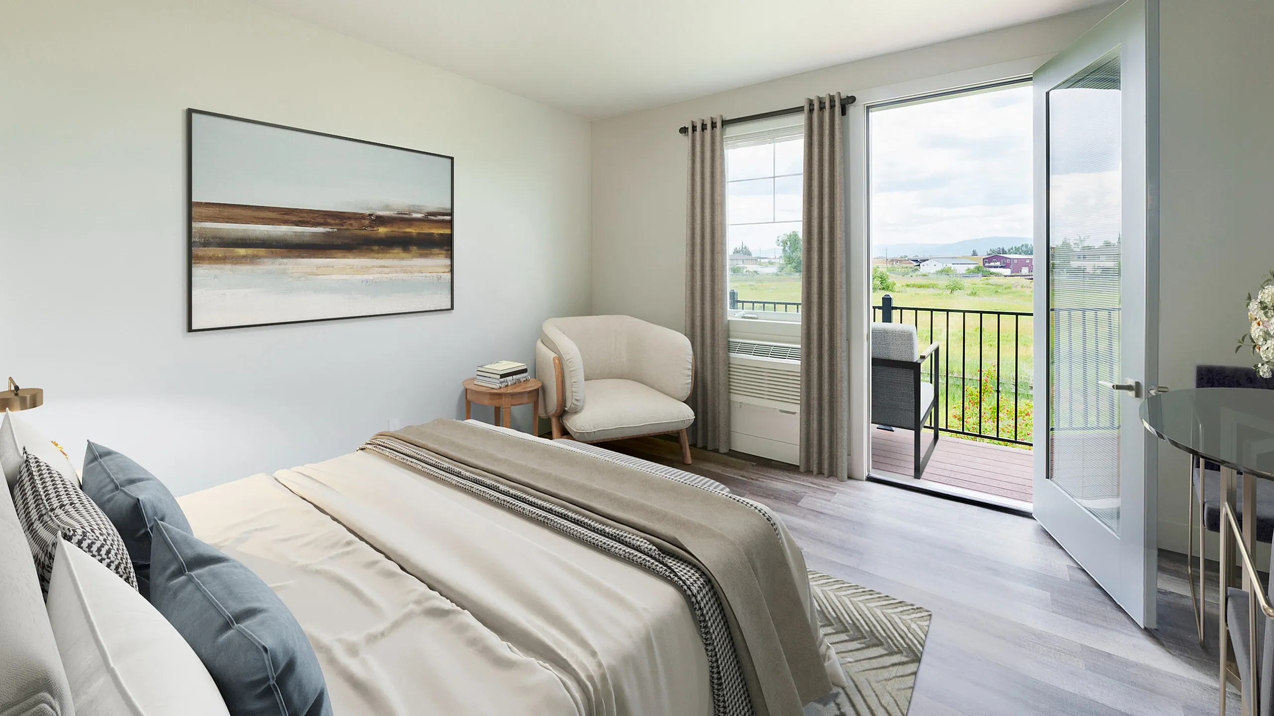 Bright and airy bedroom with modern decor, featuring large windows opening to a scenic view and cozy seating area.