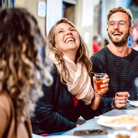 Three friends having dinner
