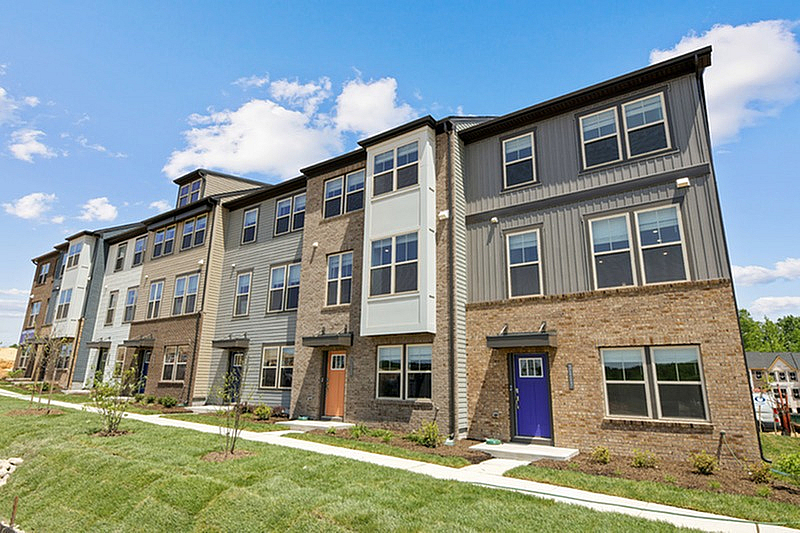 The Current at Watershed exterior of townhomes with brick and siding - Laurel, MD