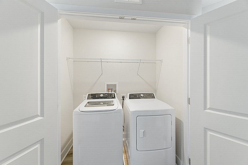 The Current at Watershed laundry closet with washer and dryer - Laurel, MD