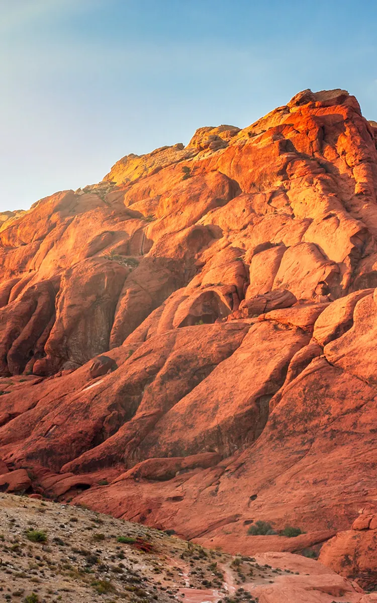 Breathtaking view of sunlit red rock formations, perfect for nature enthusiasts and adventure seekers.