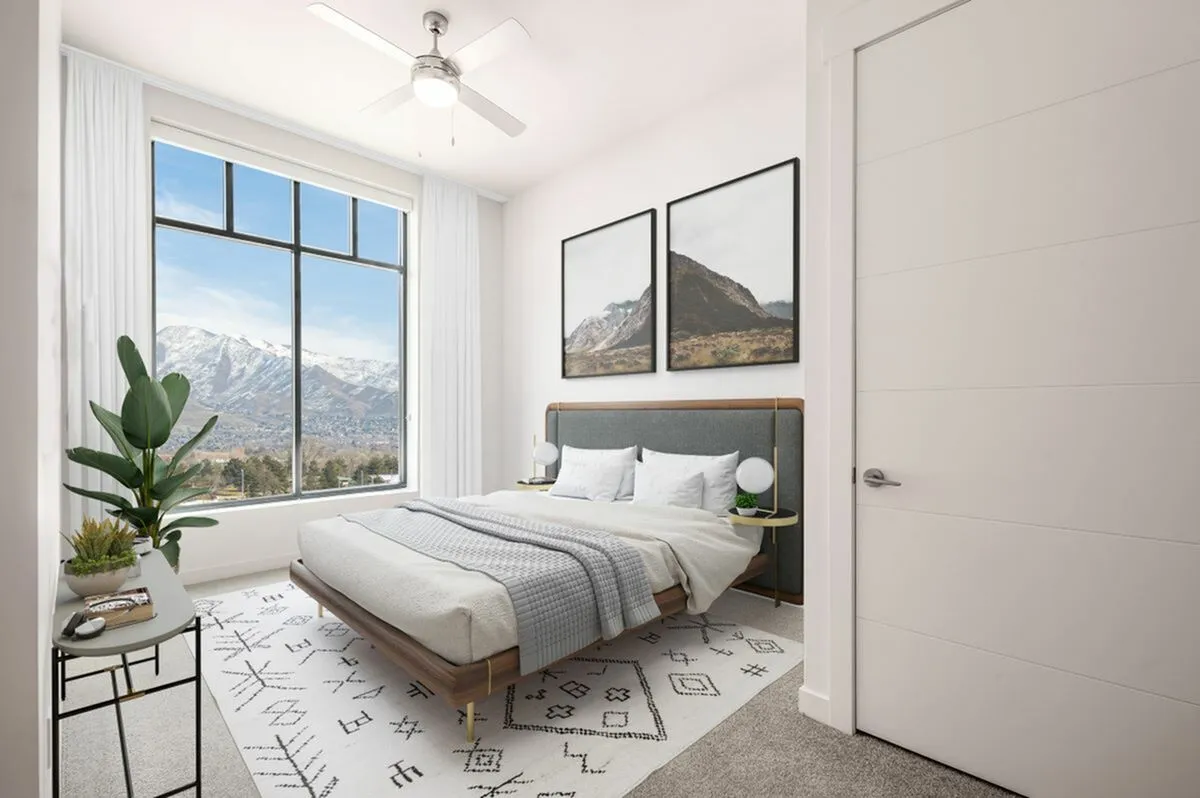 View of Park Avenue's 1-Bedroom Model in Salt Lake City Showing Mountain Views and Bed