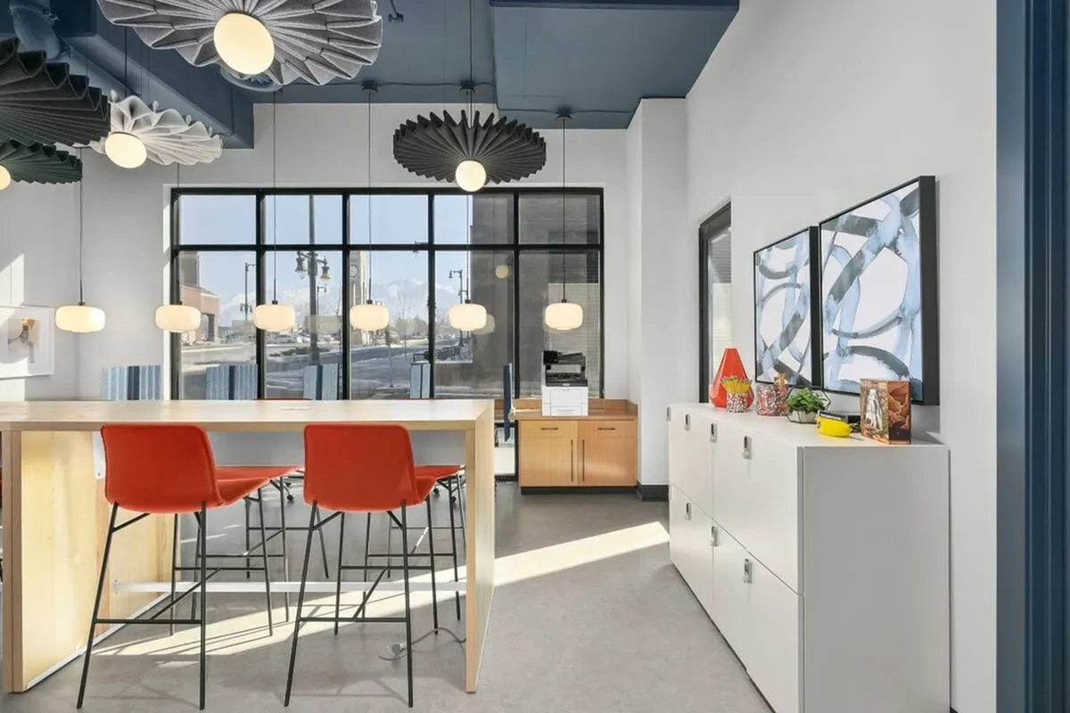 View of Apt CoWork Showing High Top Seating and Storage Lockers