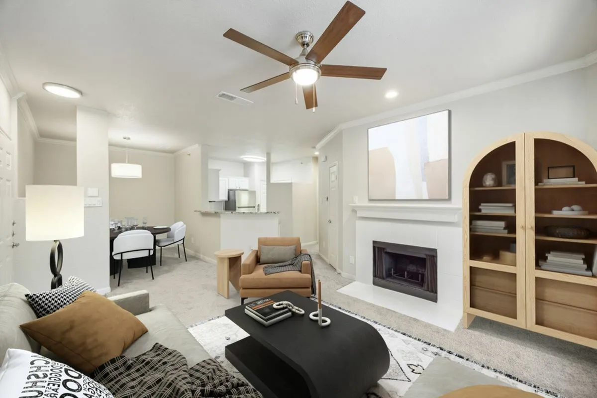 View of Renovated Apartment Living Area, Dining, Room and Kitchen with Stainless Steel Appliances