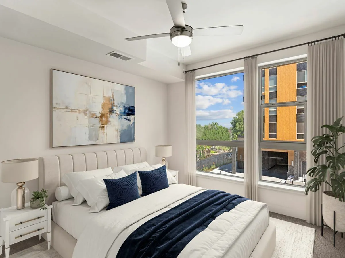 Elegant 1 bedroom apartment in Millcreek with large window and modern decor.