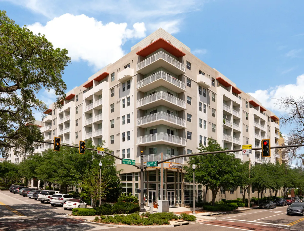 Exterior of Cottonwood Bayview Apartments in St Petersburg, Florida with spacious balconies, abundant natural light, and lush greenery, ideal urban living.