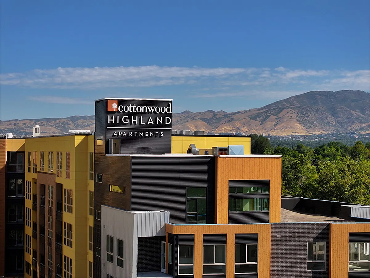 Modern Cottonwood Highland Apartments with vibrant architecture set against stunning mountain views.