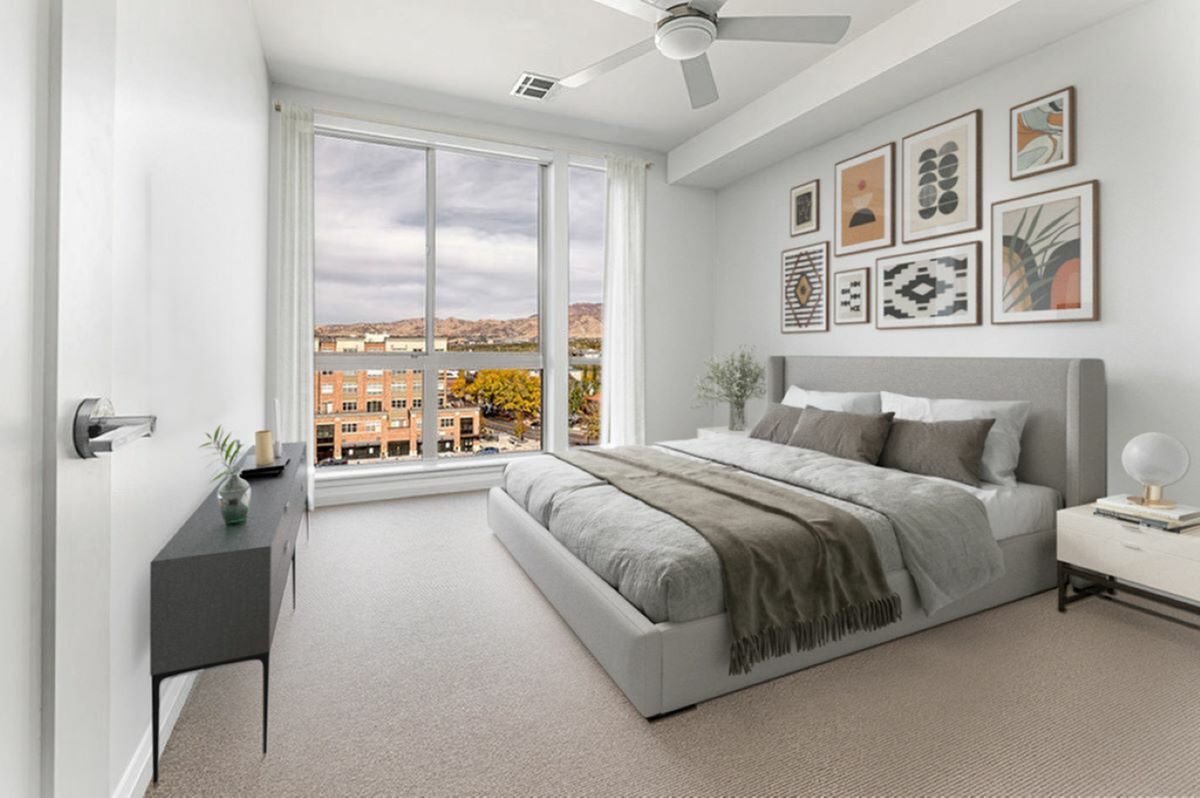 View of Bedroom Showing Bed, Two Bedside Tables, Dresser and Mountain Views at Sugarmont Apartments