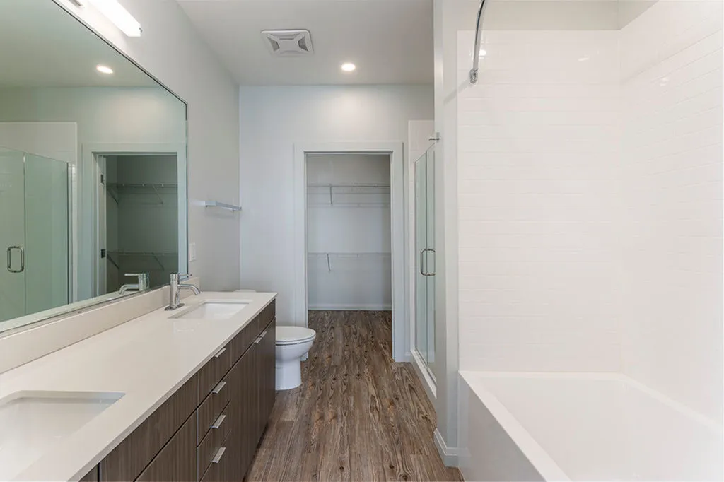 View of Bathroom, Showing Dual Vanity, Soaking Tub, and Stand-In Shower at Sugarmont Apartments