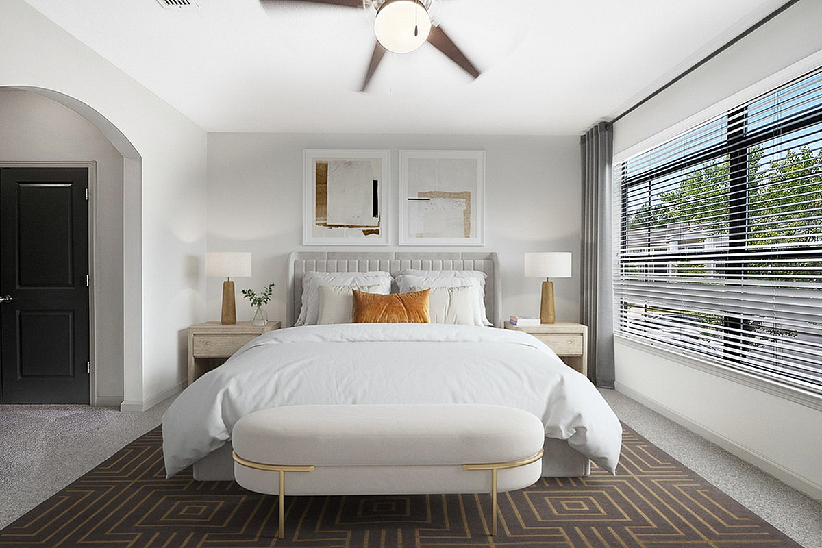 Modern bedroom at Heights at Meridian Apartments with elegant decor, featuring a plush bed, stylish nightstands, and large windows inviting abundant natural light.
