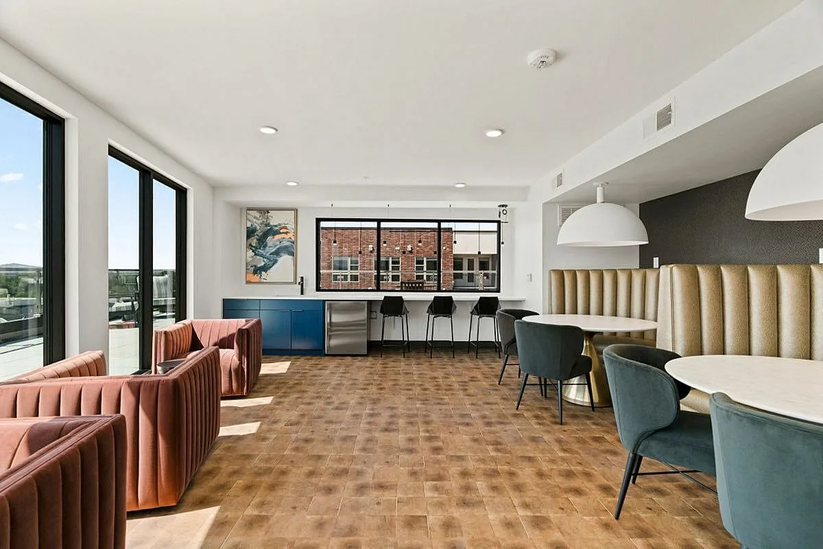 Sky lounge with stylish seating, expansive windows, and sleek finishes for sophisticated living at The Richmond Apartments in Millcreek Utah