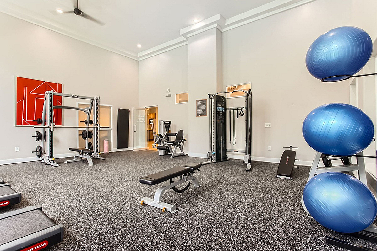 Scott Mountain's modern fitness center featuring state-of-the-art gym equipment, bright spacious design, and stylish decor.