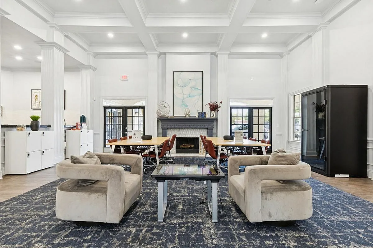 Elegant and spacious communal workspace with plush seating, modern decor, and natural light, perfect for working from home at Stonebriar at Frisco Apartments