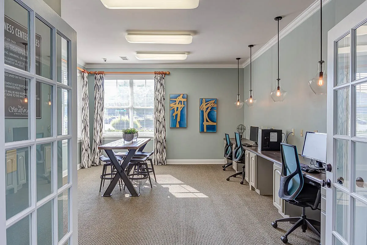 Bright and modern office space at The Stratford at Hillcrest Towne Center Apartments with stylish decor, natural light, and a collaborative work environment.