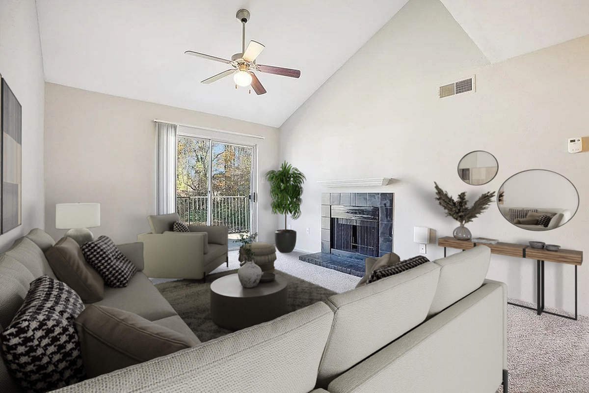 1 Bedroom Apartment living room with vaulted ceilings, cozy fireplace, and a large window framing a scenic view at Park at Midtown Apartments