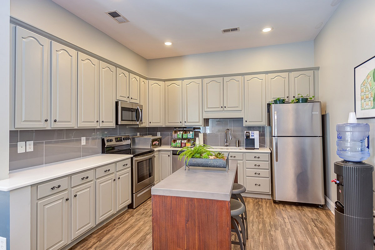 Modern kitchen with elegant cabinetry, stainless steel appliances, and a sleek island for entertaining at Morgan Ridge Apartments.