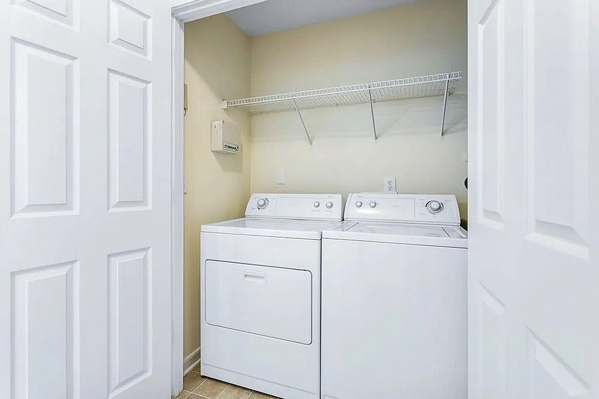 Bright, modern laundry area at Morgan Ridge Apartments with a sleek washer and dryer set, offering convenience and style for any apartment.