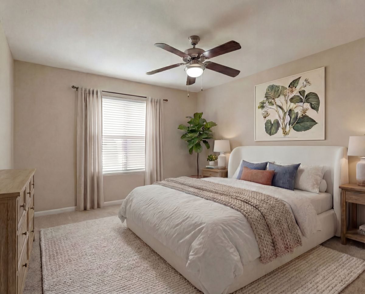 Inviting bedroom with modern decor, featuring a cozy bed, stylish artwork, and abundant natural light at Steepleway Downs in Houston TX