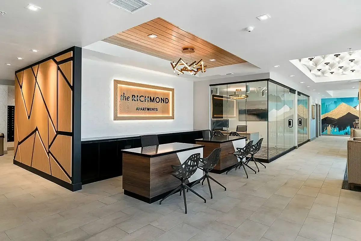 Sleek and modern apartment lobby at The Richmond, featuring stylish decor, comfortable seating, and vibrant wall art  at The Richmond Apartments in SLC Utah