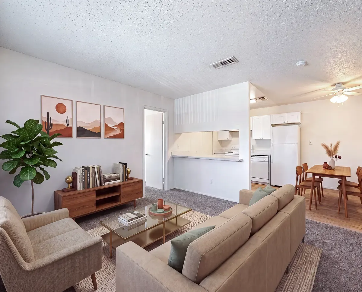 Inviting living room with modern decor, cozy seating, and an open kitchen leading to a charming dining area.