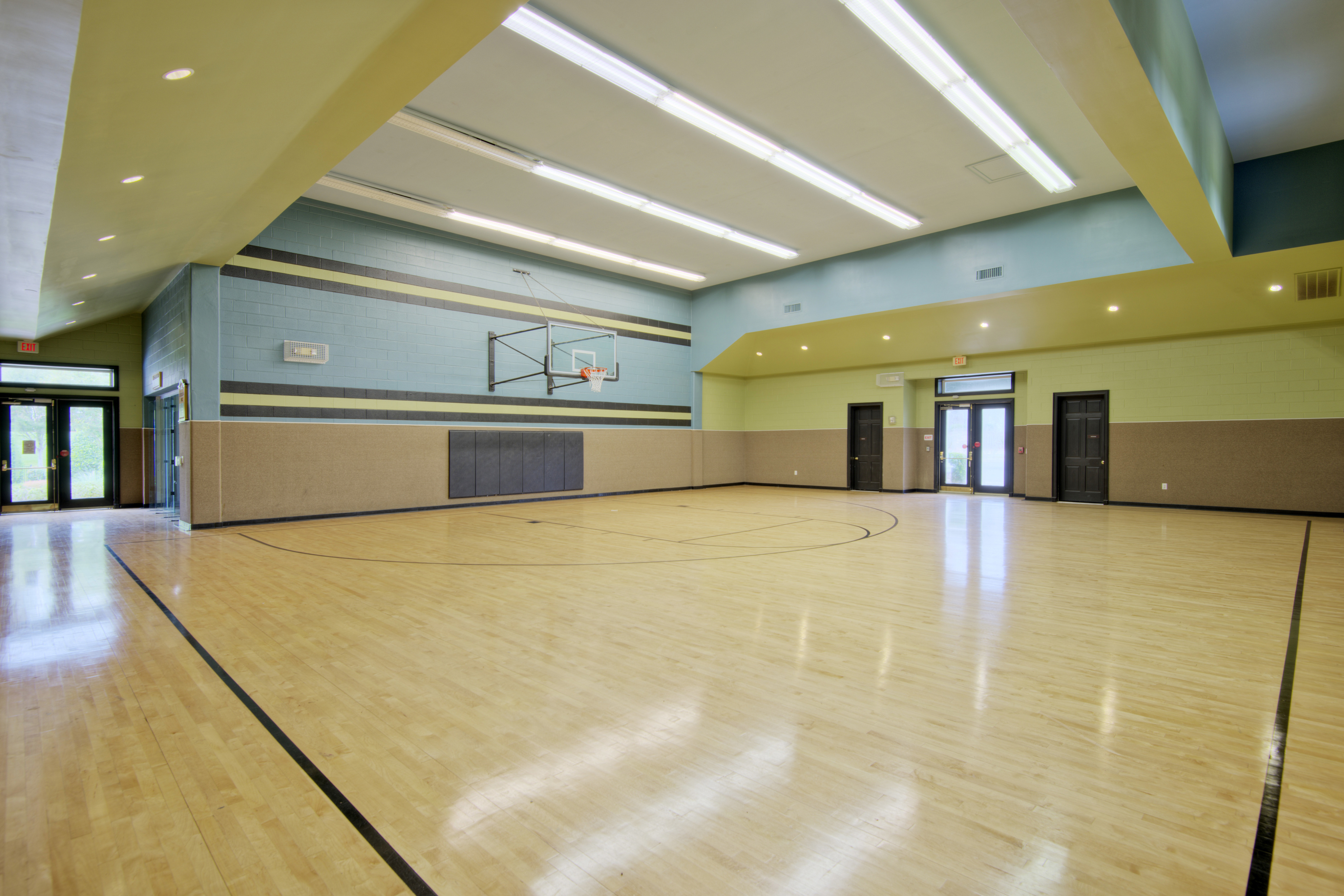 View of Indoor Sport Court, Showing Full-Size Basketball Court at Cottonwood Reserve Apartments