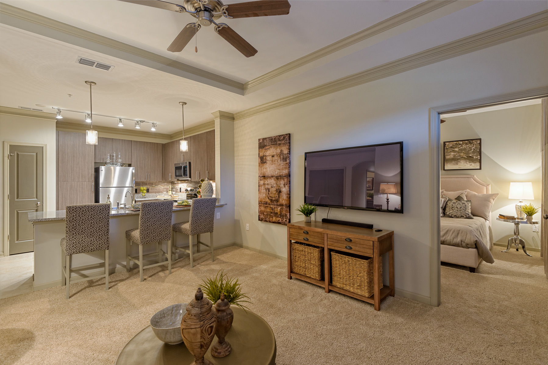 View of Living Room, Showing Ceiling Fan, View of Kitchen and Bedroom at Heights at Meridian Apartments