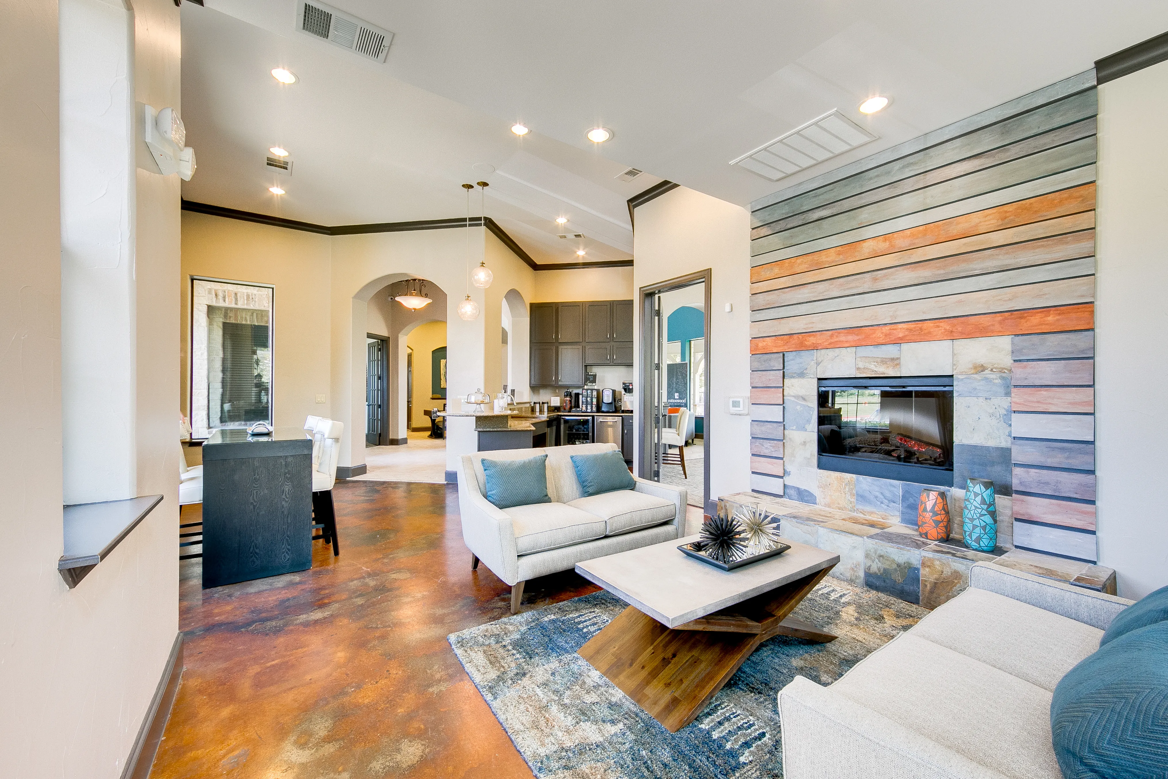 View of Clubhouse, Showing Seating Area, Coffee Bar, and Fireplace at Enclave on Golden Triangle Apartments