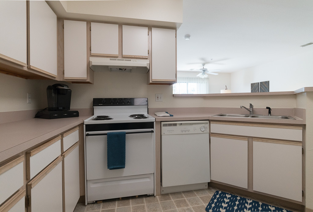 View of Kitchen, Showing Gas Appliances, Counters, Cabinetry, Double Sink, and Tile Flooring at Clearview Apartments