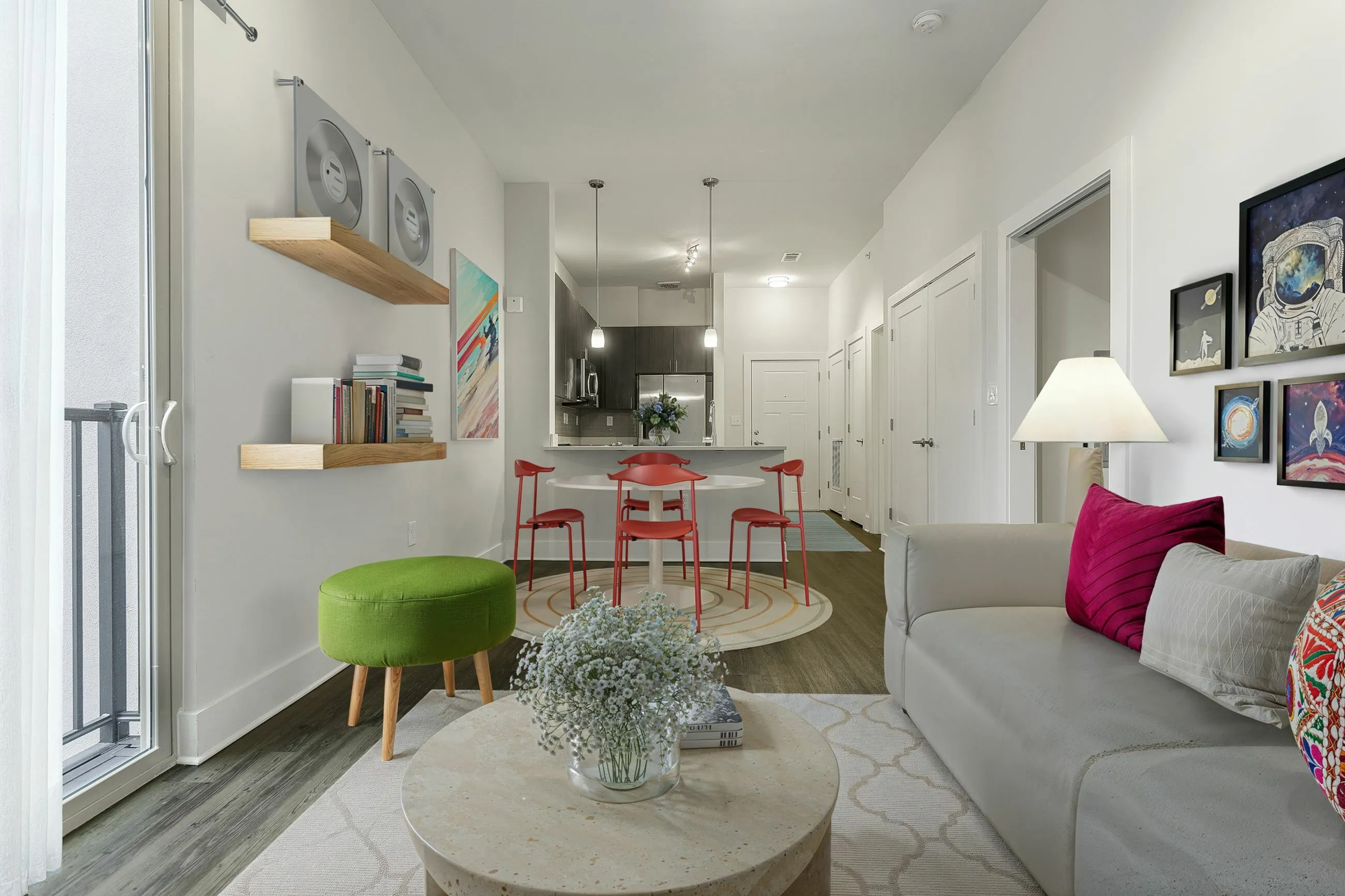 Stylish open-concept living area with modern decor and vibrant accents.