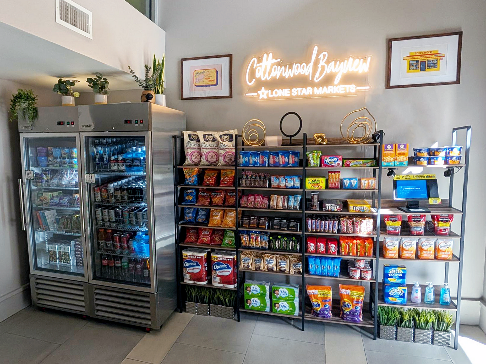 The Market at Cottonwood Bayview Apartments showcasing a well-stocked snack bar with chilled beverages, assorted chips, and convenient essentials, perfect for a quick pick-me-up in downtown st Petersburg