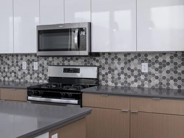 Image of Quartz Countertops with Hex Mosaic Backsplash for Sugarmont Apartments & Townhomes
