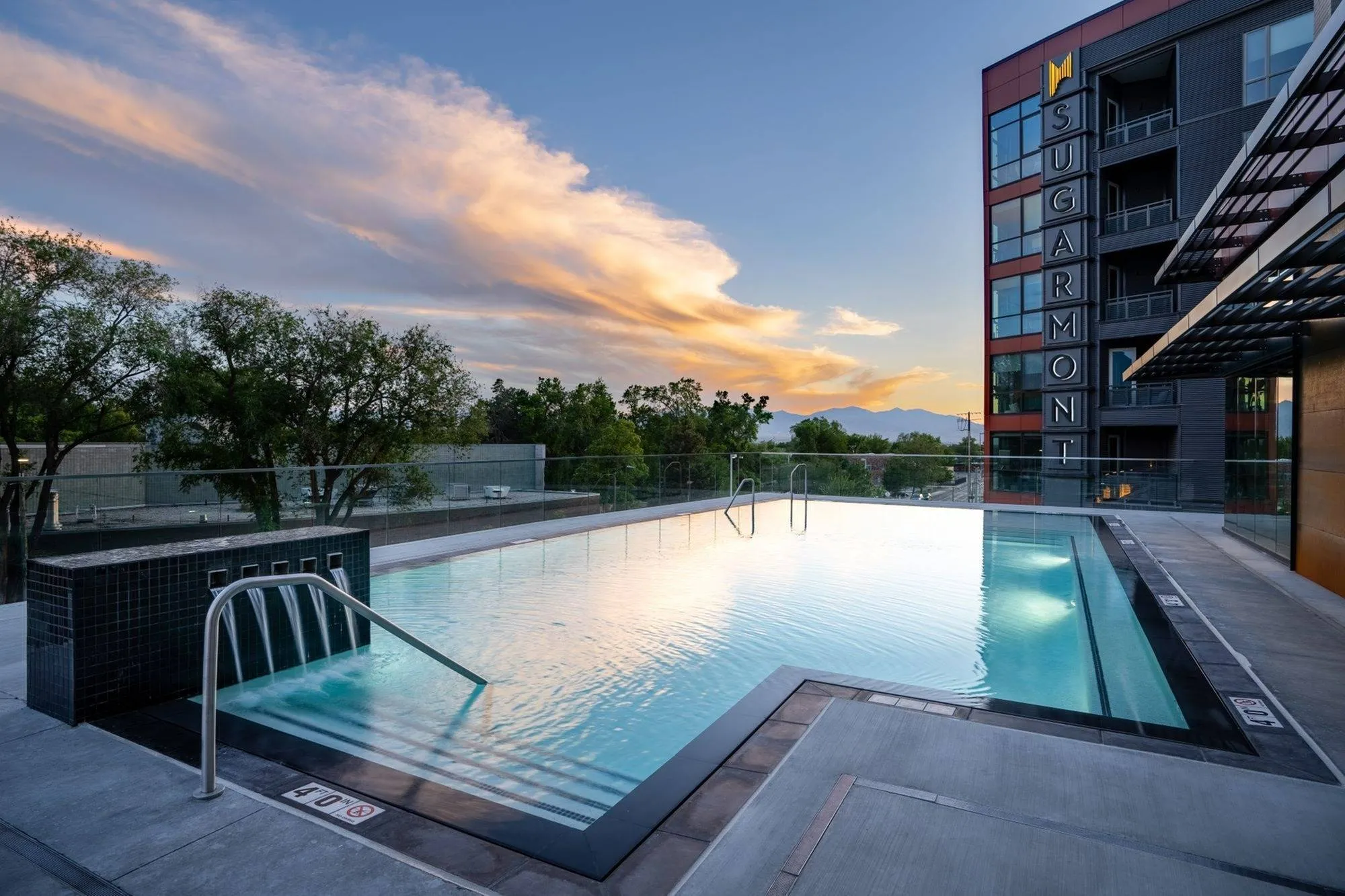 View of Pool Deck, Grilling Area, Sun Lounge Area, and Townhouses Below