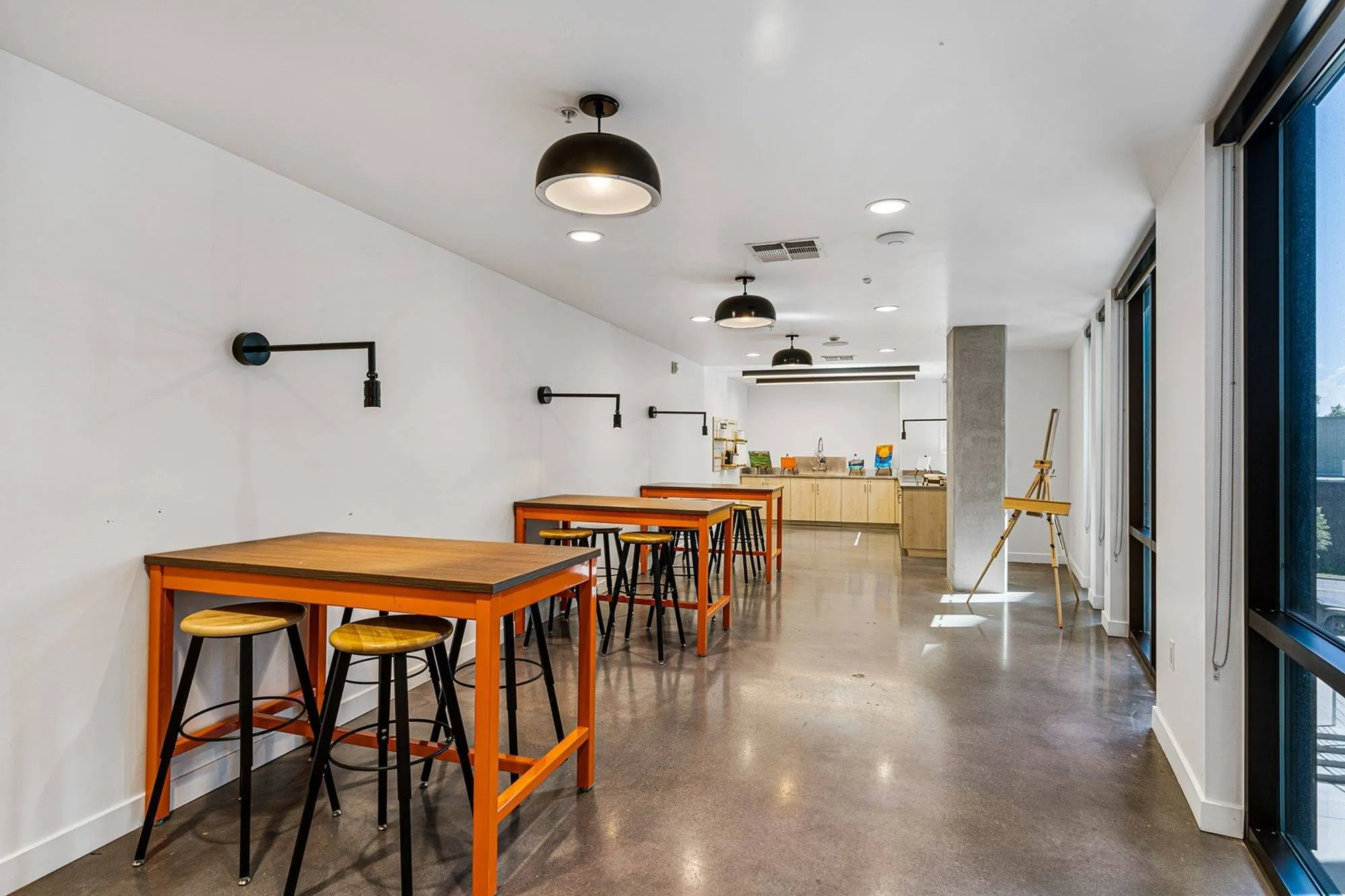 Maker & Art Studio Showing Work Countertops, Stools, Black Matte Lighting, and Easel