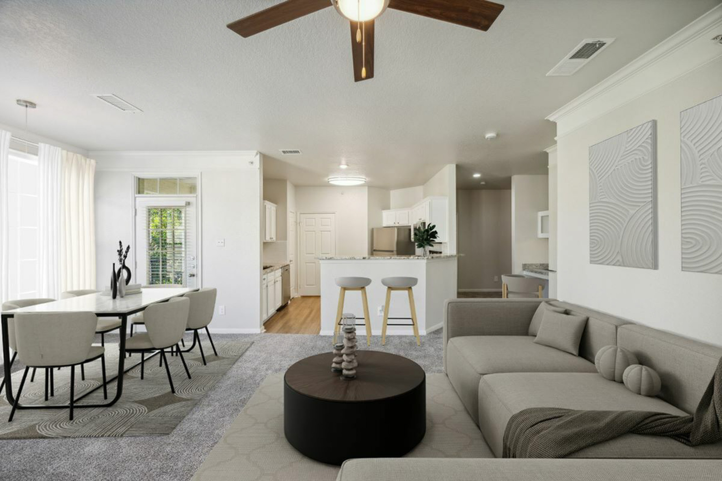 Modern open-concept living area with elegant dining set, cozy sectional sofa, and contemporary kitchen design.