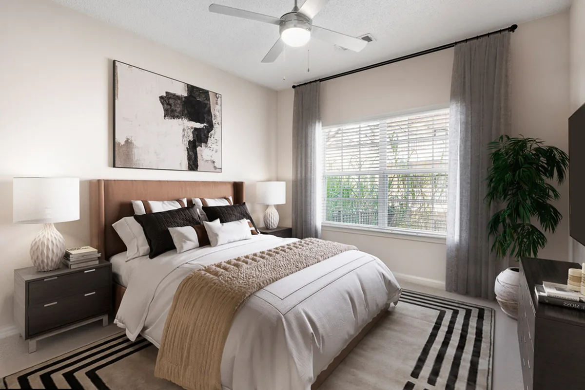 Inviting bedroom with elegant decor, plush bedding, and natural light filtering through large windows for a serene ambiance.