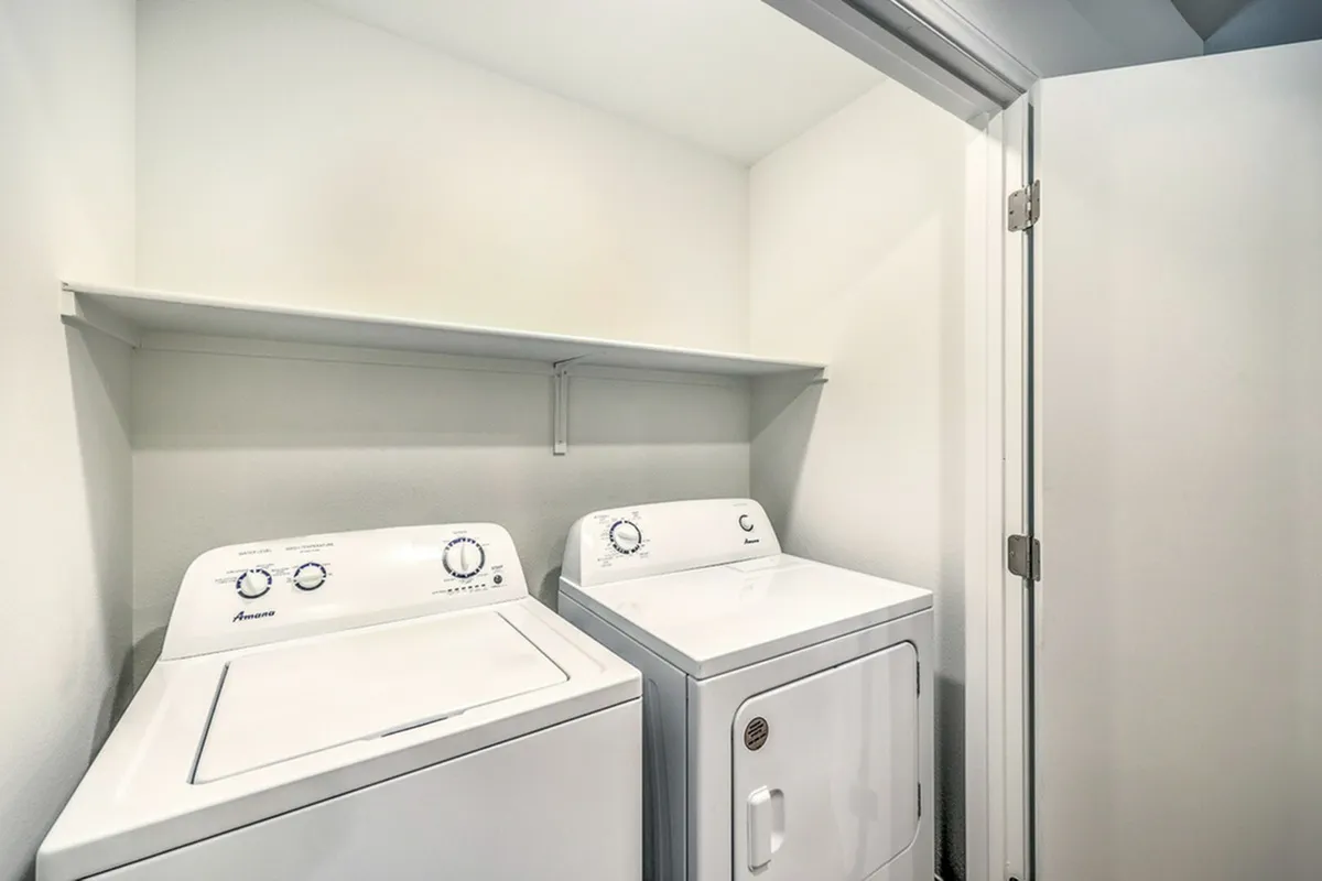 Bright and efficient laundry room featuring modern washer and dryer, optimized for convenience and style.