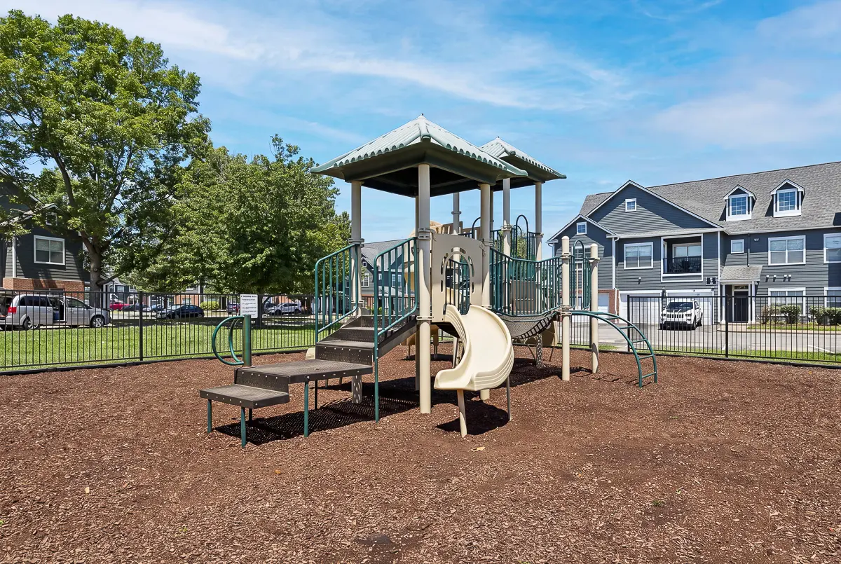 Inviting playground with modern equipment located in a vibrant apartment community, perfect for family enjoyment and outdoor fun.