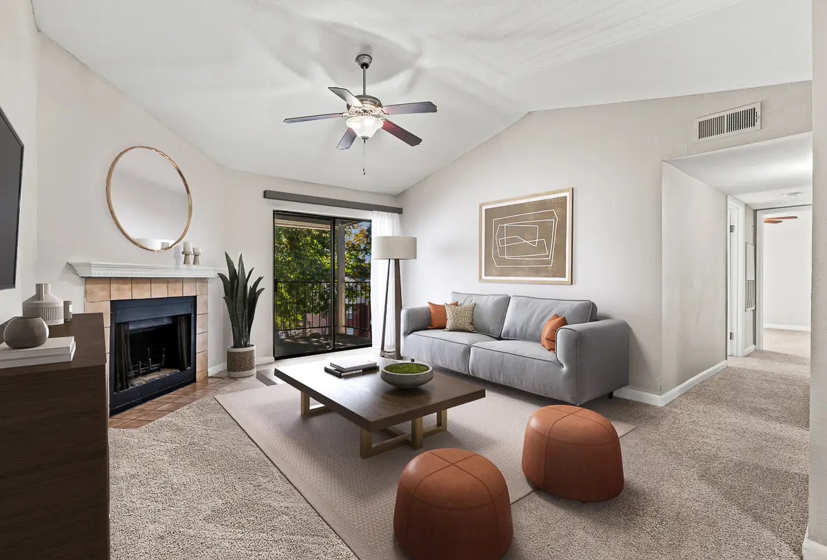 Elegant living room with a cozy fireplace, stylish decor, and an inviting open dining area, perfect for modern living.