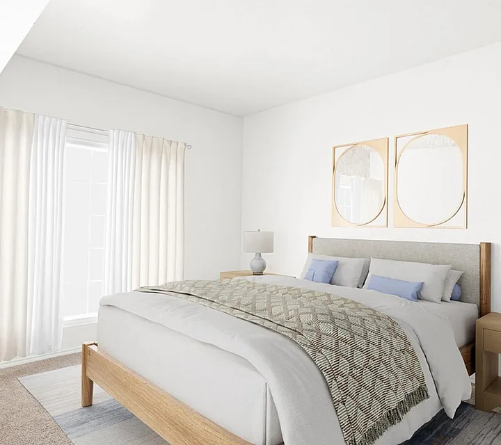 Elegant bedroom at Fox Point in Old Farm Apartments with a cozy bed, soft lighting, and minimalist decor featuring modern artwork and neutral tones.